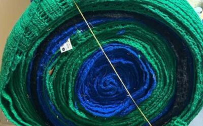 Record-Breaking Knitters Donate Bales of Scarves to KLC’s Joseph Jersey Project